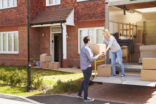 Careful moving of household items through a doorway