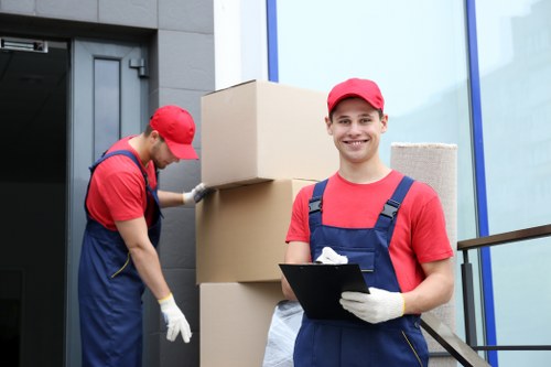 Professional movers loading furniture and boxes for transport in South Tottenham