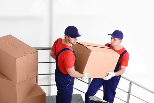 Local removal team handling office furniture in South Tottenham