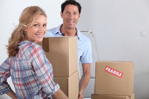 Professional movers loading household items for a South Tottenham relocation