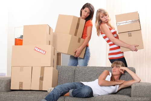 Professional moving team working safely with equipment